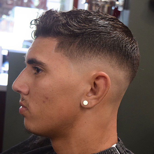 Adrian Mitchell's precision fade with textured top