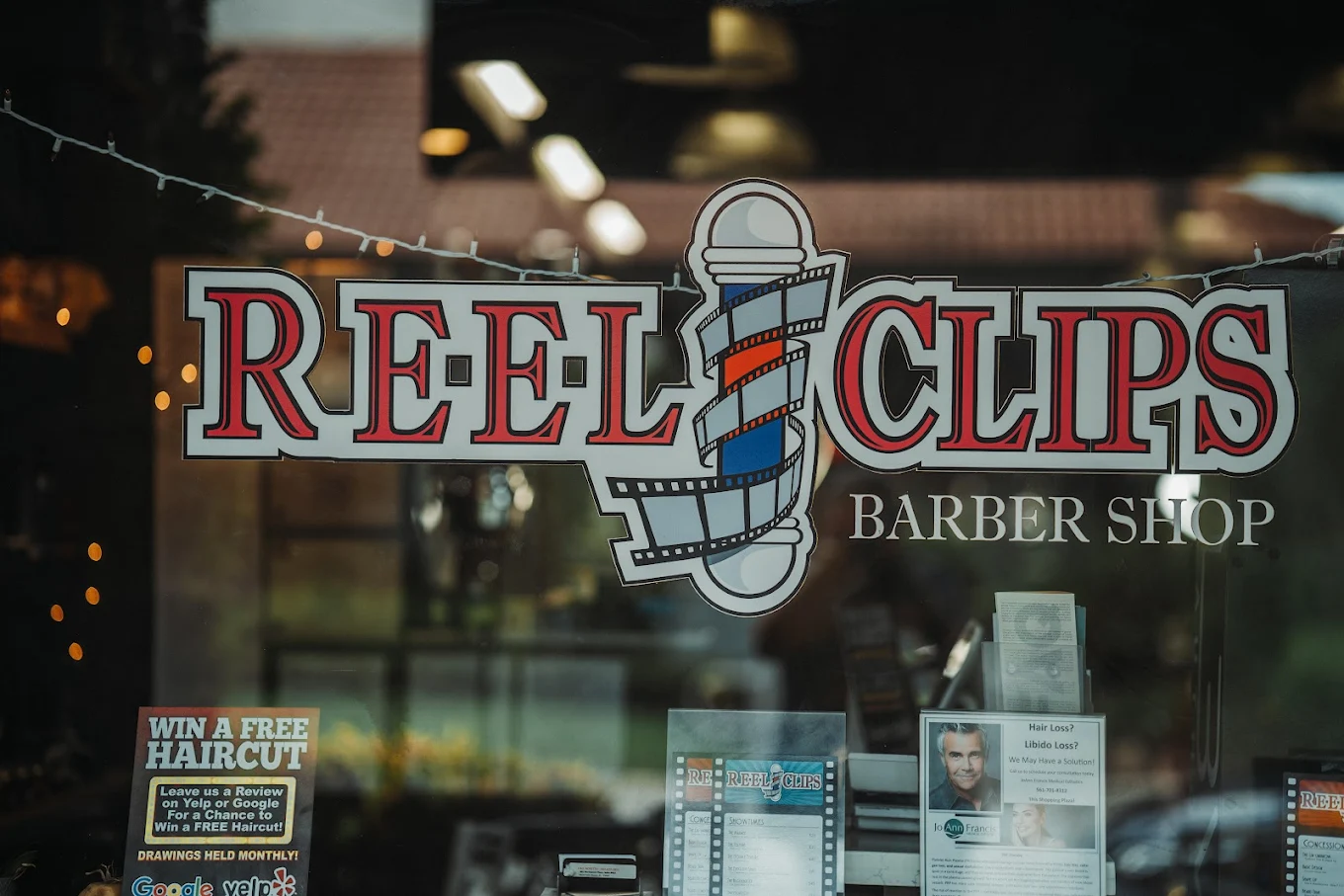 Reel Clips Barbershop Storefront and Window Display